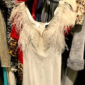 Prima donna, white gown! Worn only once! Trimmed in white feathers.